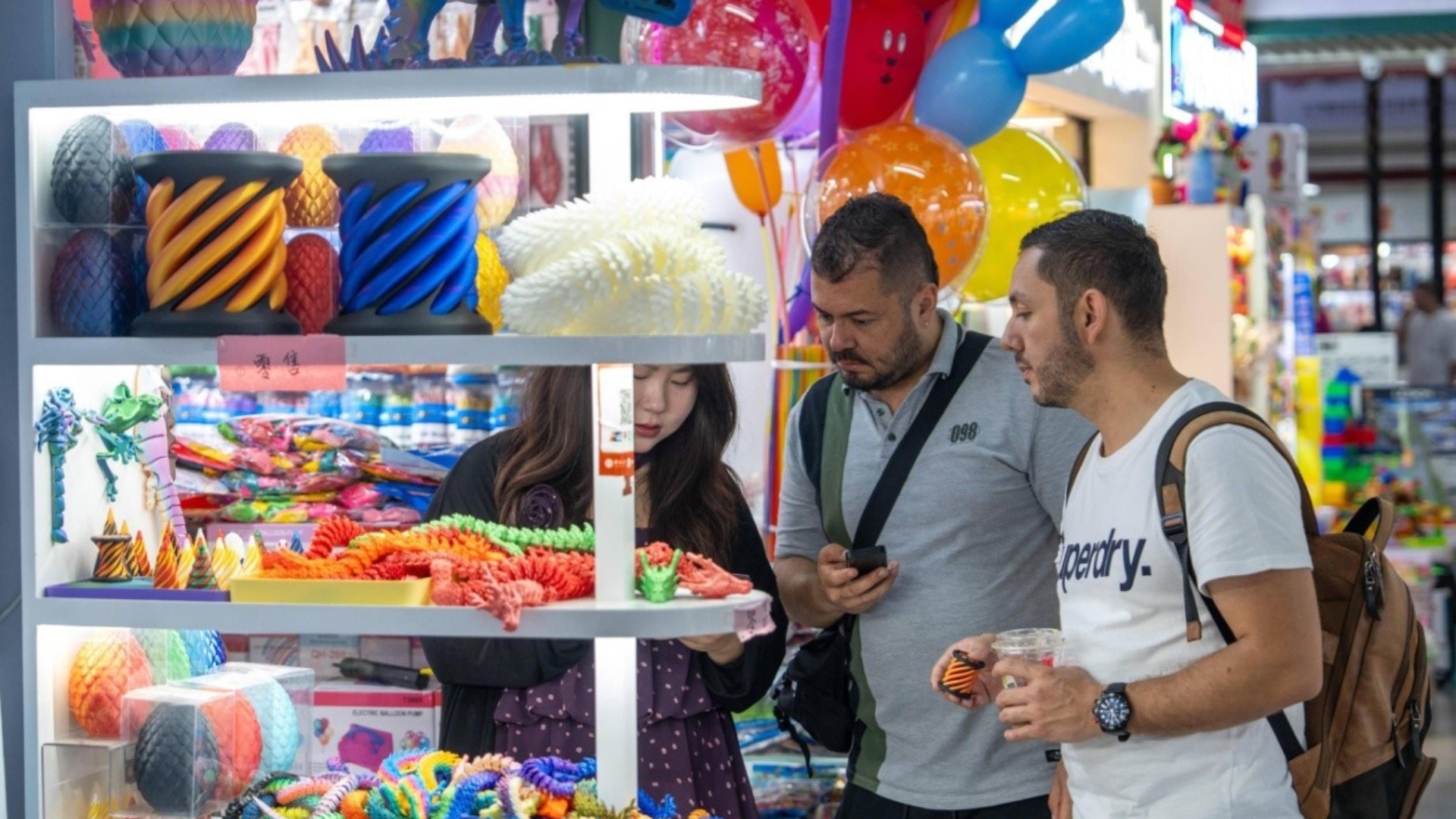 Foreign merchants purchase toys at the Yiwu International Trade Market in Yiwu, East China's
