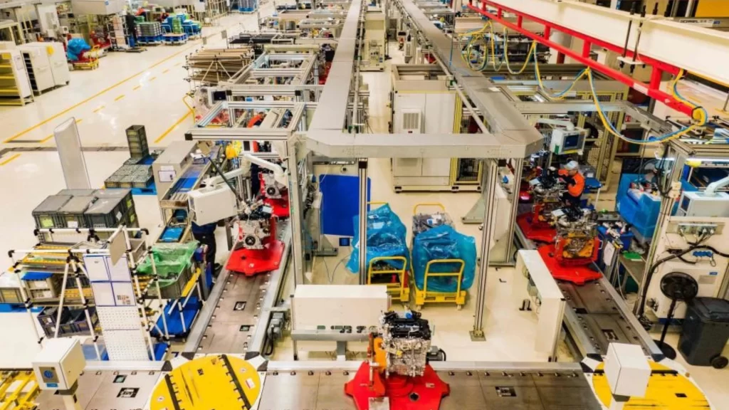 High-tech engine assembly line at Great Wall Motors featuring robotic arms and precision engineering.
