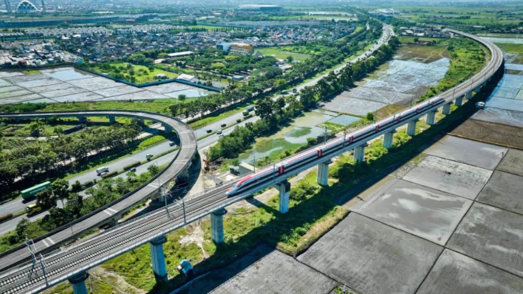 Modern high-speed train traveling across China's extensive 50,000-kilometer rail network, connecting remote regional hubs.