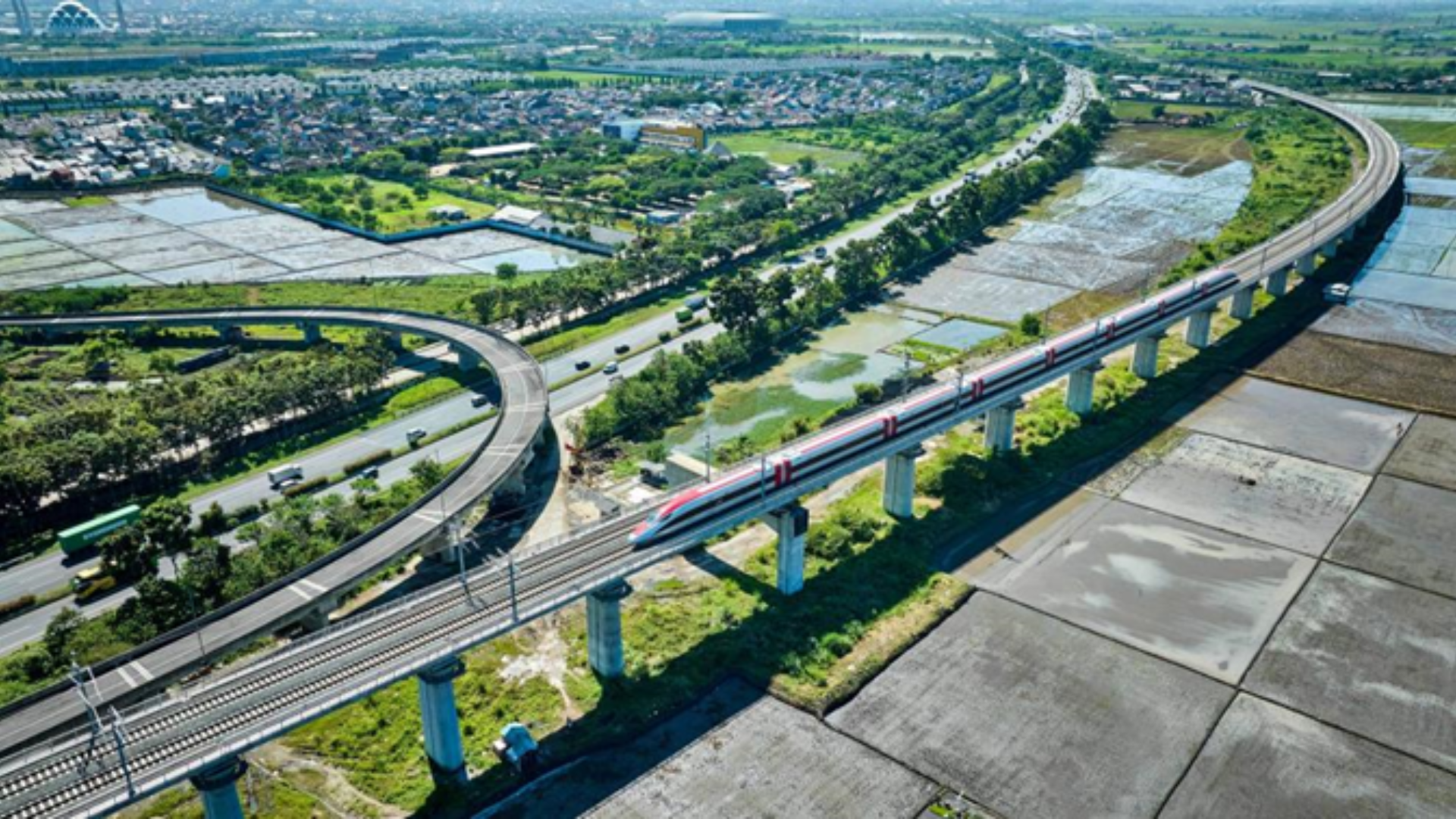 Modern high-speed train traveling across China's extensive 50,000-kilometer rail network, connecting remote regional hubs.