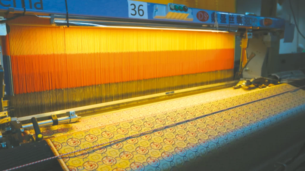 Advanced AI looms weaving intricate Song brocade patterns, blending traditional craftsmanship with high-tech industrial precision.