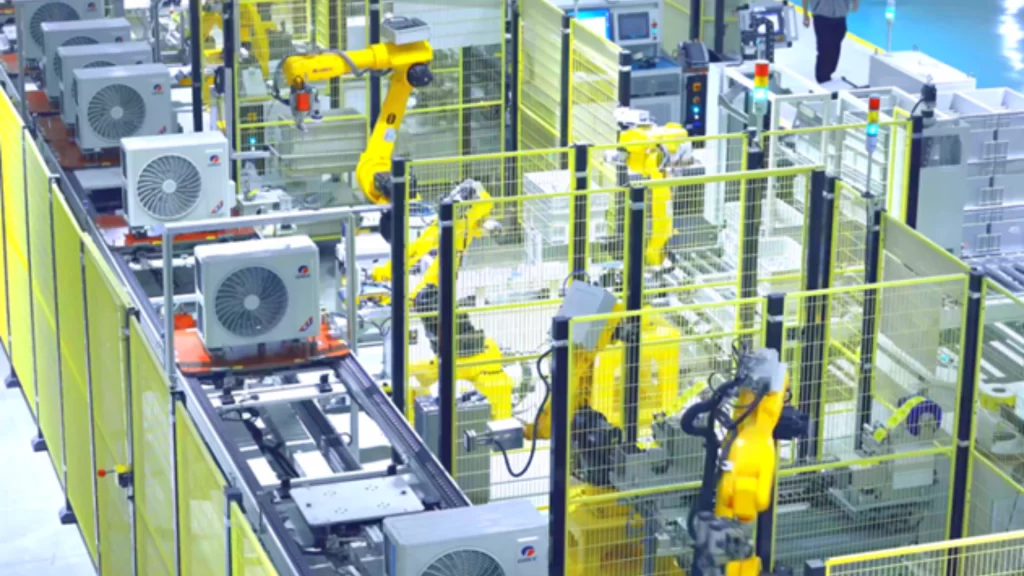 Digital display screen at a smart factory showing real-time manufacturing data and model changeover times.