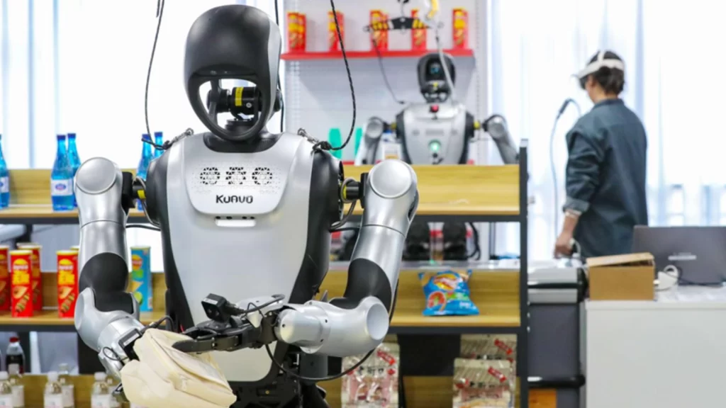 A humanoid robot and a robotic dog interact with guests at a high-tech corporate event.