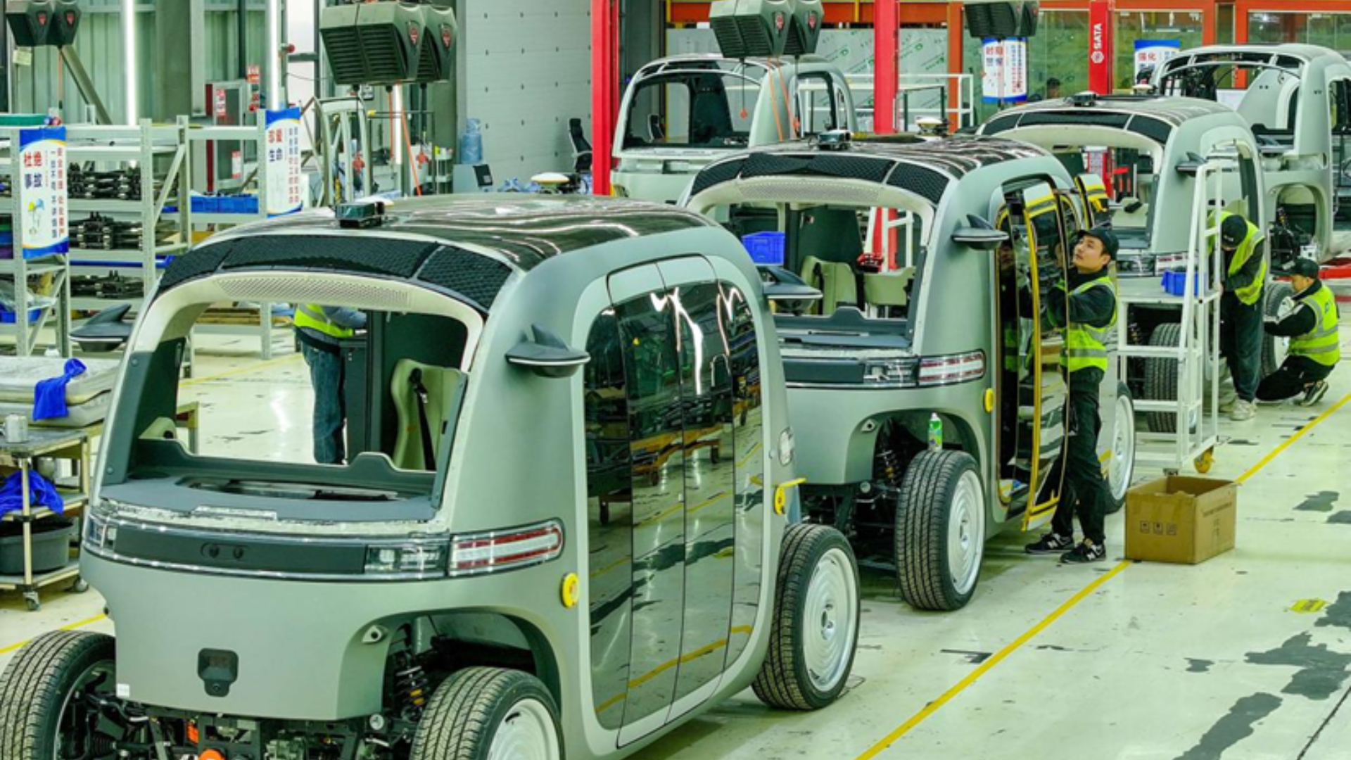 Deep underground, a massive transparent spherical detector at JUNO captures elusive neutrinos within a steel truss.