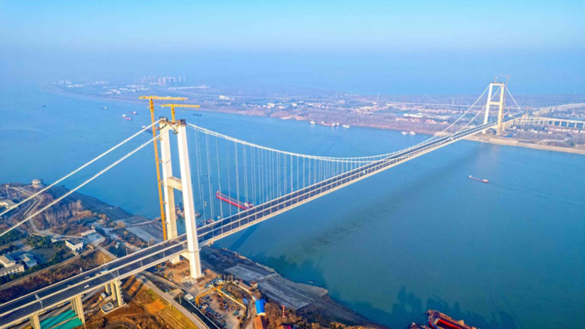 The single-span Shuangliu Yangtze River Bridge features an enclosed sound barrier to protect wetland wildlife.