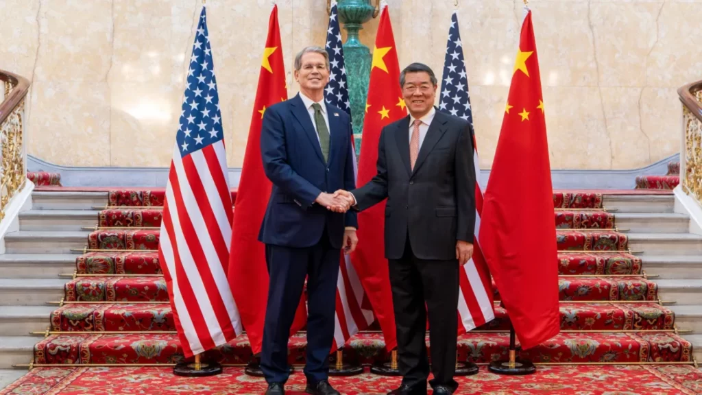 China and U.S. officials meet in France to pursue win-win trade cooperation and economic stability.