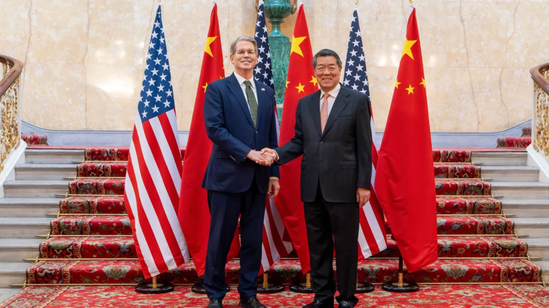China and U.S. officials meet in France to pursue win-win trade cooperation and economic stability.