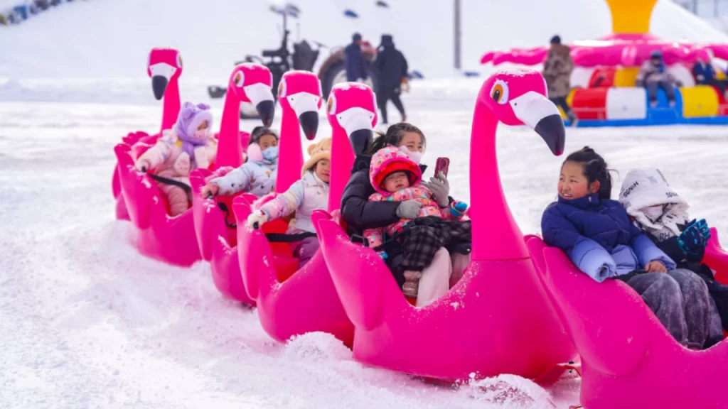 China's booming ice-and-snow economy driving global tourism, high-tech manufacturing, and winter sports industry growth.