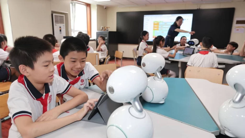 Students in a Chinese classroom using interactive robots and tablets powered by large AI models.