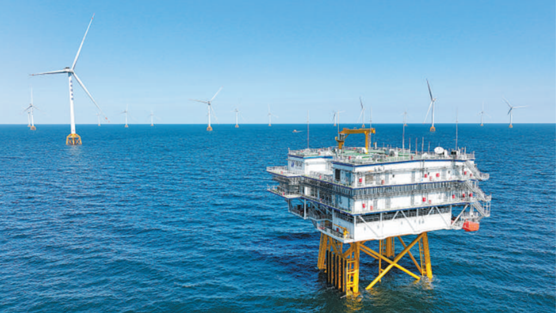 Offshore wind turbines and a substation platform in deep waters off China's Shandong Peninsula.