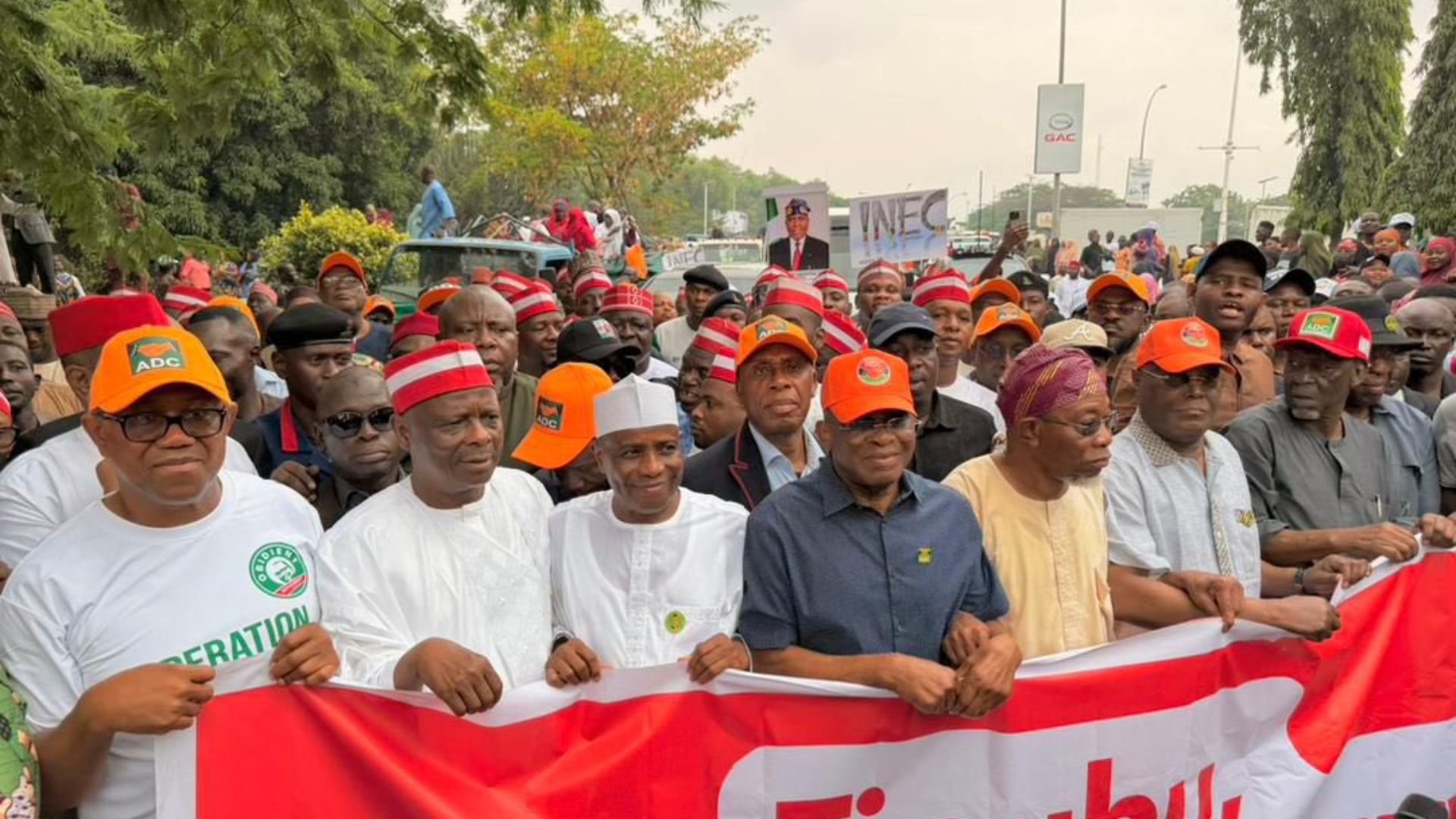 Political stalwarts and ADC leaders protesting at INEC headquarters in Abuja for democratic integrity.