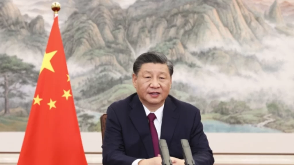 Chinese President Xi Jinping delivers a speech on the Global Security Initiative at a desk.