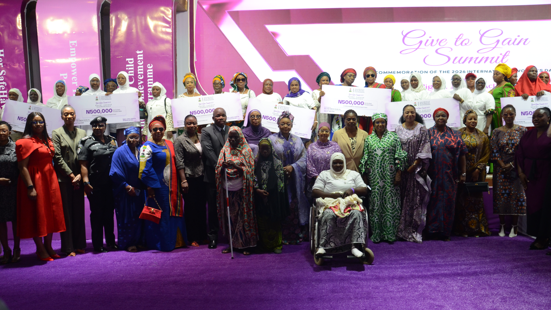 Women receive N500,000 empowerment grants at the Give to Gain Summit in Abuja.