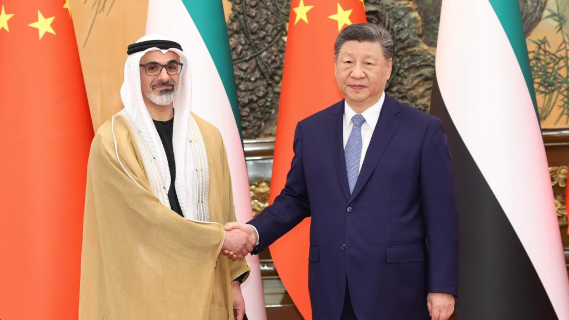 President Xi Jinping and Crown Prince Sheikh Khaled shake hands, promoting China’s Middle East peace proposal.