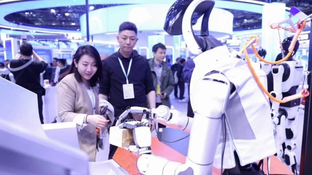 A humanoid robot demonstrates precise object handling at the 2026 Zhongguancun Forum for tech innovation.