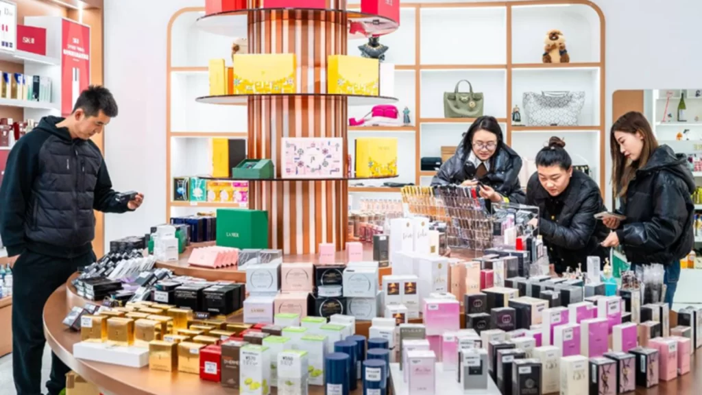 Customers browse skincare and luxury products at a duty-free shop in Inner Mongolia.