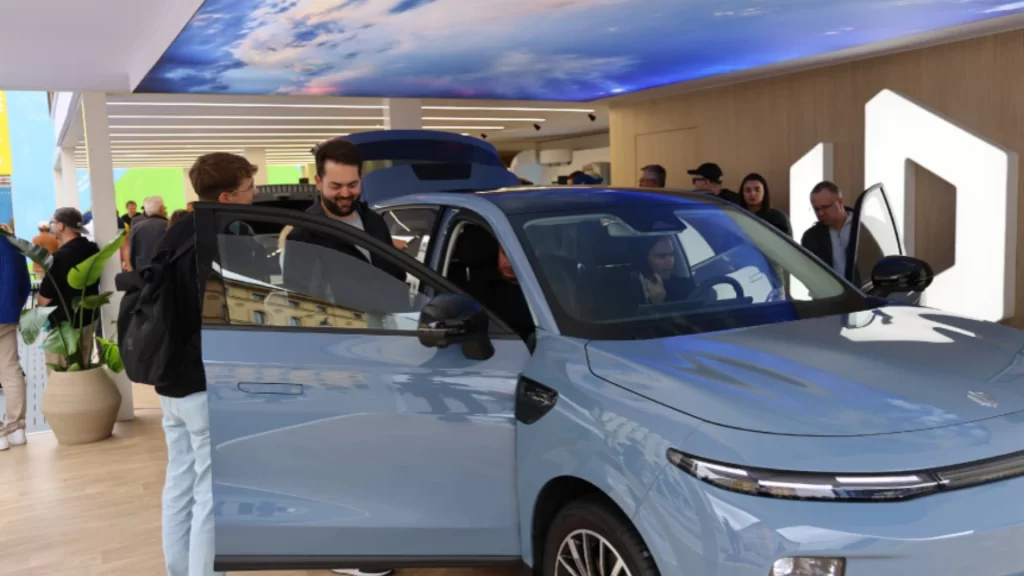 Visitors explore Leapmotor’s new energy vehicles, highlighting growing Chinese and European automotive innovation partnerships.
