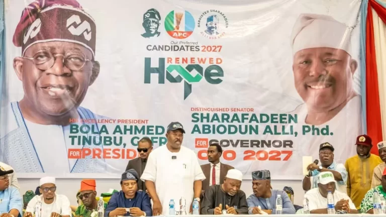 An APC 2027 campaign banner for Bola Tinubu and Oyo State gubernatorial candidate Sharafadeen Alli.
