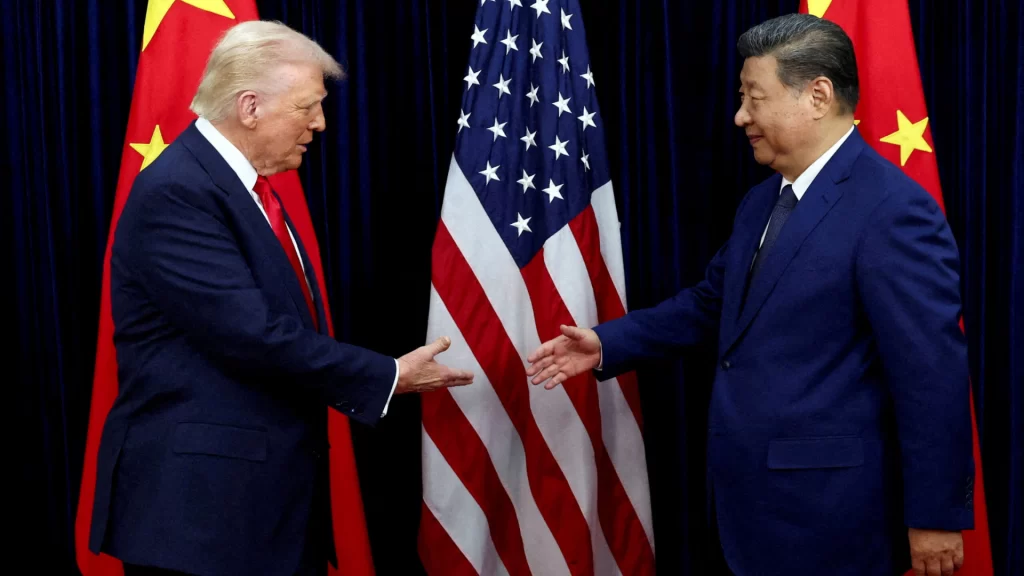 Presidents Donald Trump and Xi Jinping shake hands during a 2026 high-level summit in Beijing.