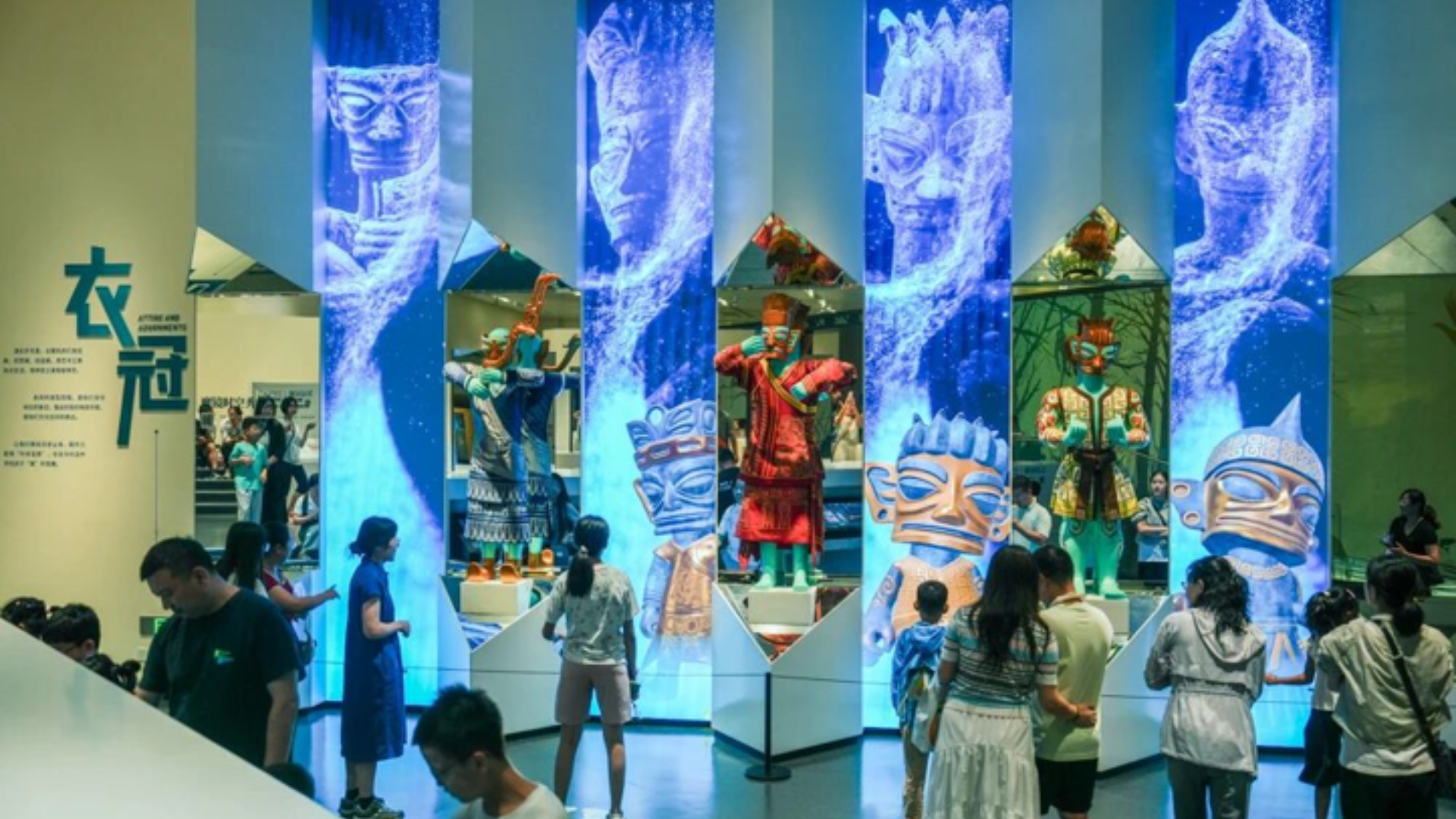 Visitors explore immersive Sanxingdui Museum exhibits featuring interactive digital displays and ancient cultural relics.