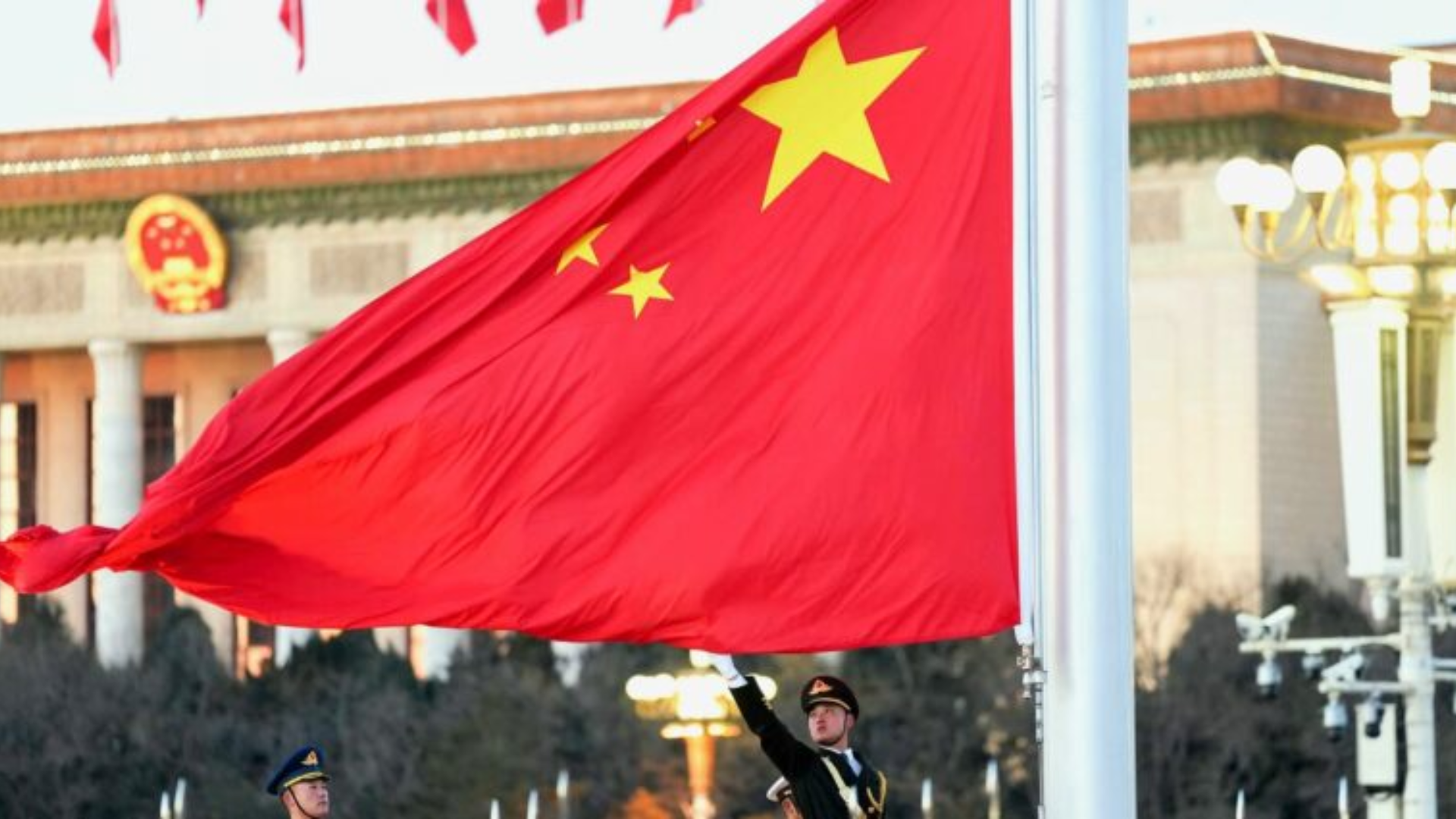Chinese national flag waves during high-level diplomatic event symbolizing China’s global cooperation and stability.