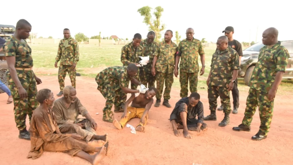 Fully armed Nigerian troops patrolling a village to counter bandit and insurgent networks.