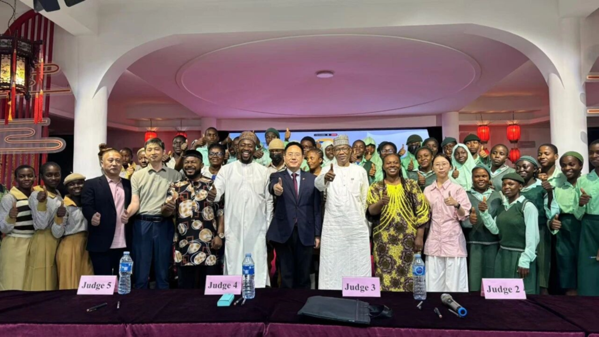 Contestants, judges and officials pose after Nigerian student wins Chinese Bridge competition in Abuja.