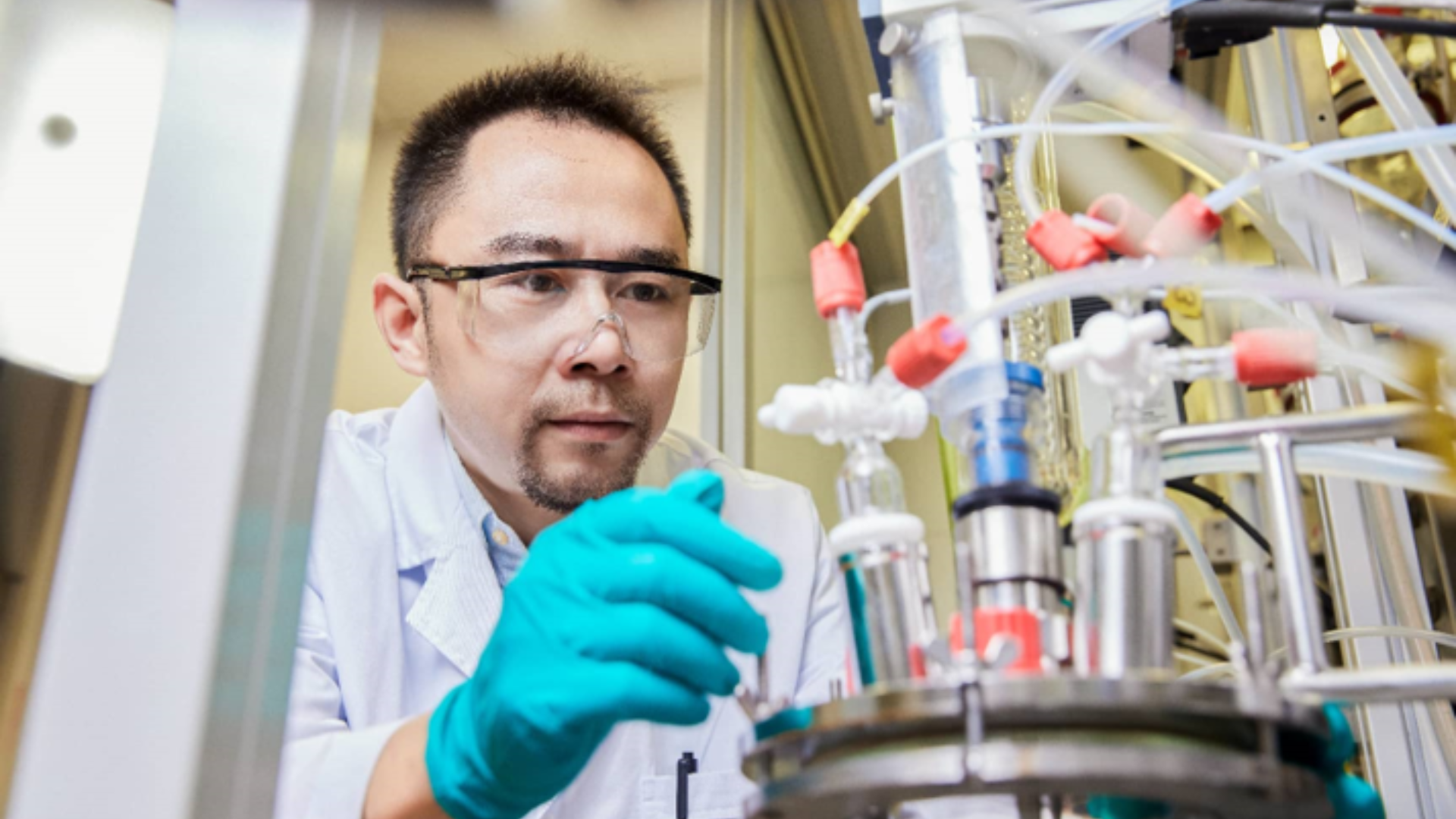 A researcher working with scientific equipment, driving the global shift from "made in China" to innovation.
