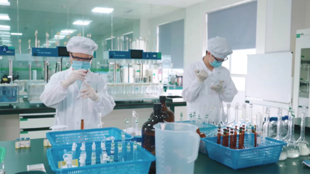 Scientists conduct laboratory experiments for pharmaceutical innovation.