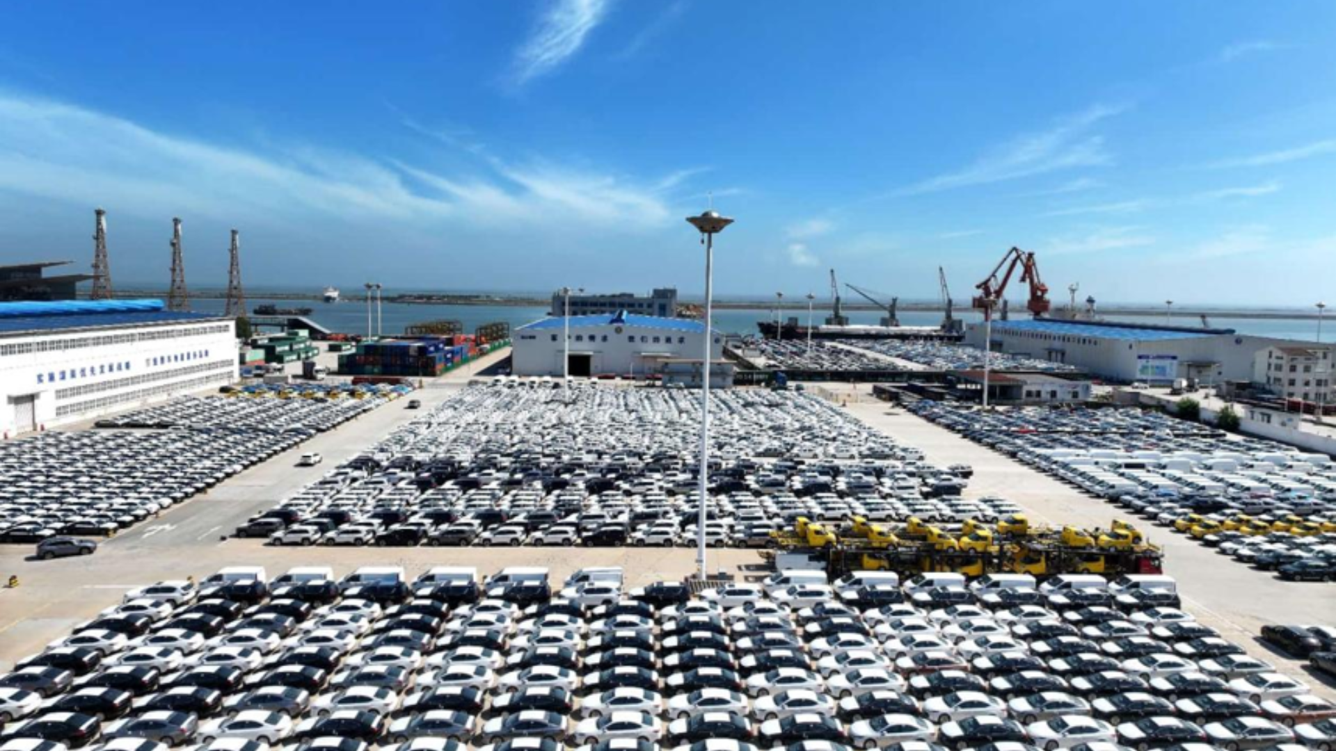 Chinese-made automobiles lined up at Lianyungang terminal for export to international markets.