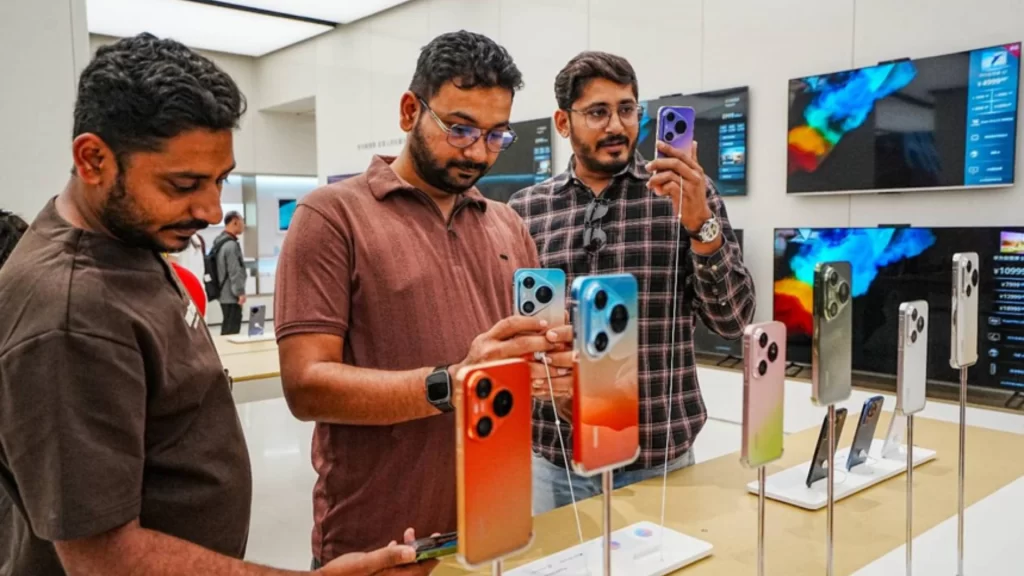 Foreign tourists explore Huawei store as China's paperless tax refunds simplify shopping and boost visitor spending.