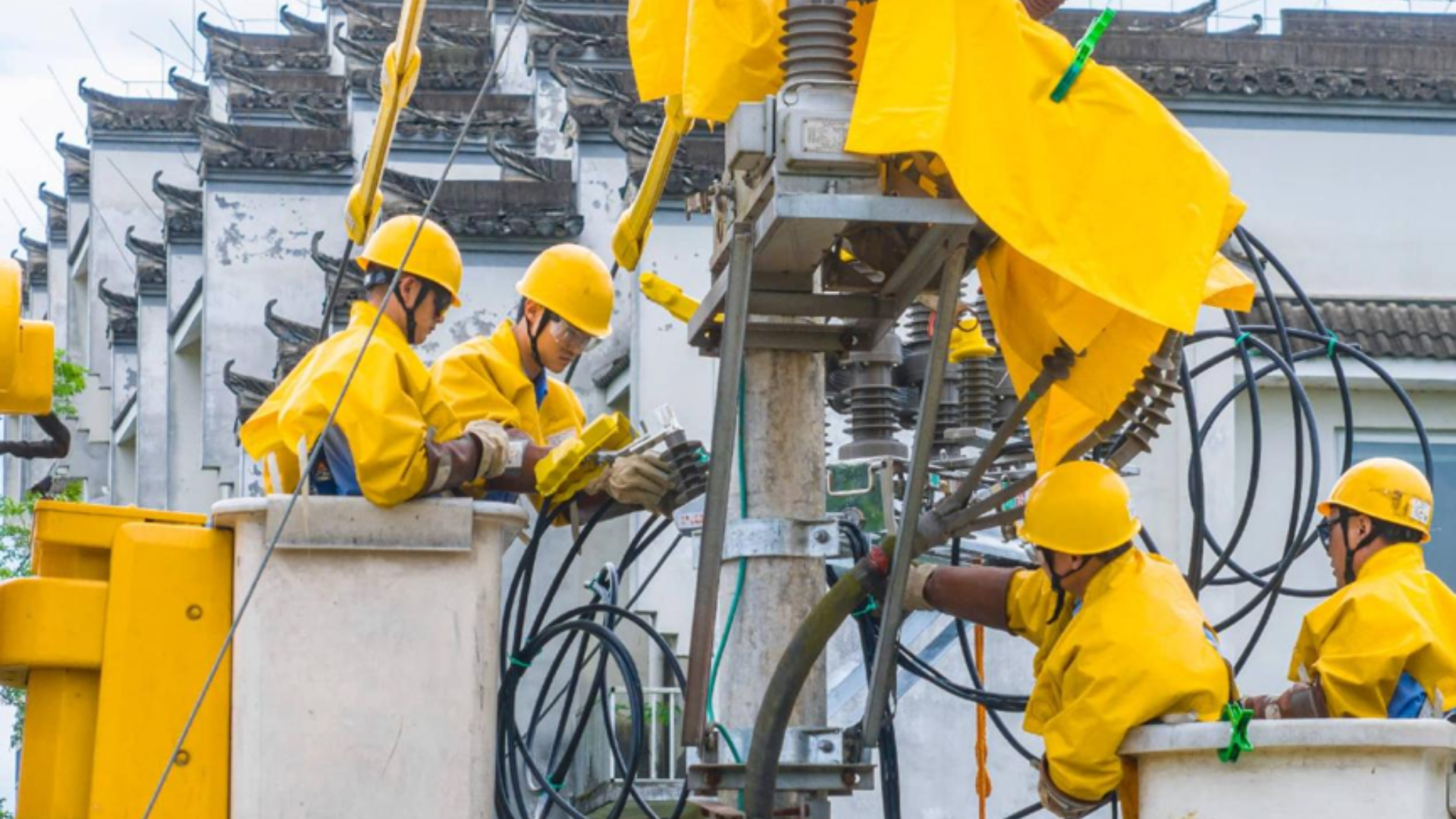Workers upgrade aging electrical infrastructure during urban renewal project in Huangshan, Anhui province.