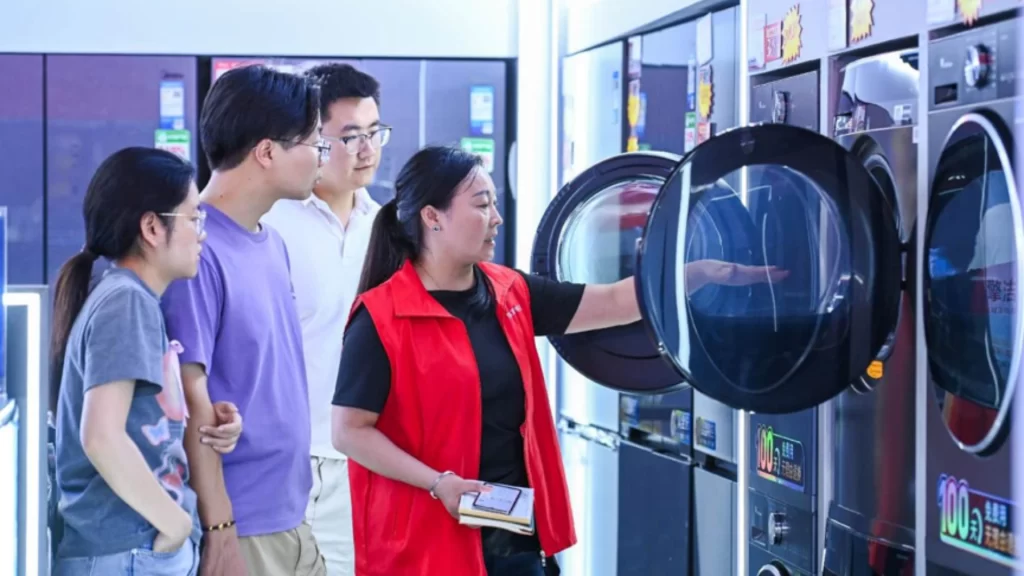 Customers shop for subsidized home appliances under China's trade-in program in Jiangxi.