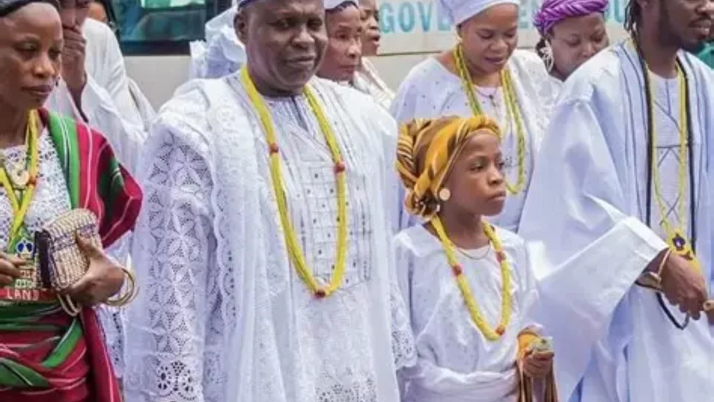 10-year-old Arugba Princess Alimot leads Osun-Osogbo Festival procession toward the Osun Sacred Grove.