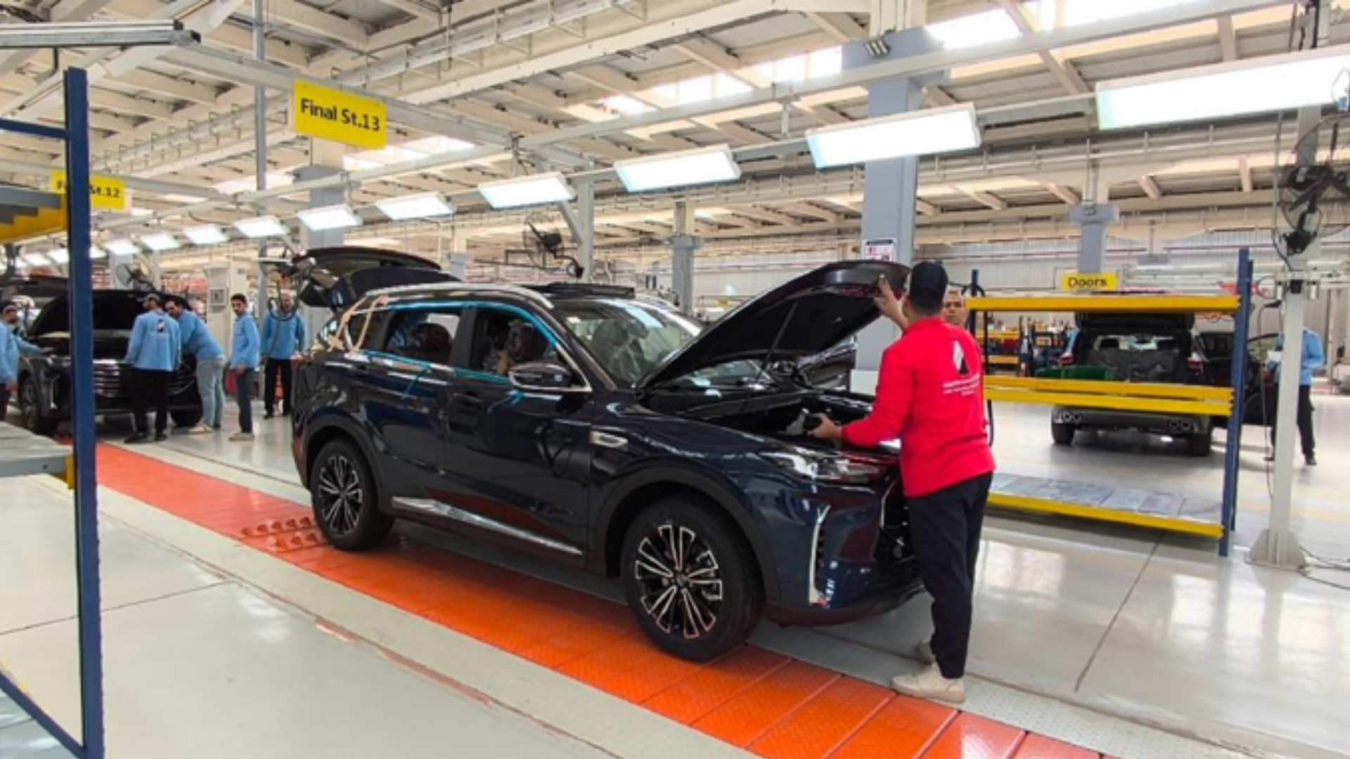 Technicians conduct final technical inspections on vehicles at a Jetour assembly plant in Egypt.
