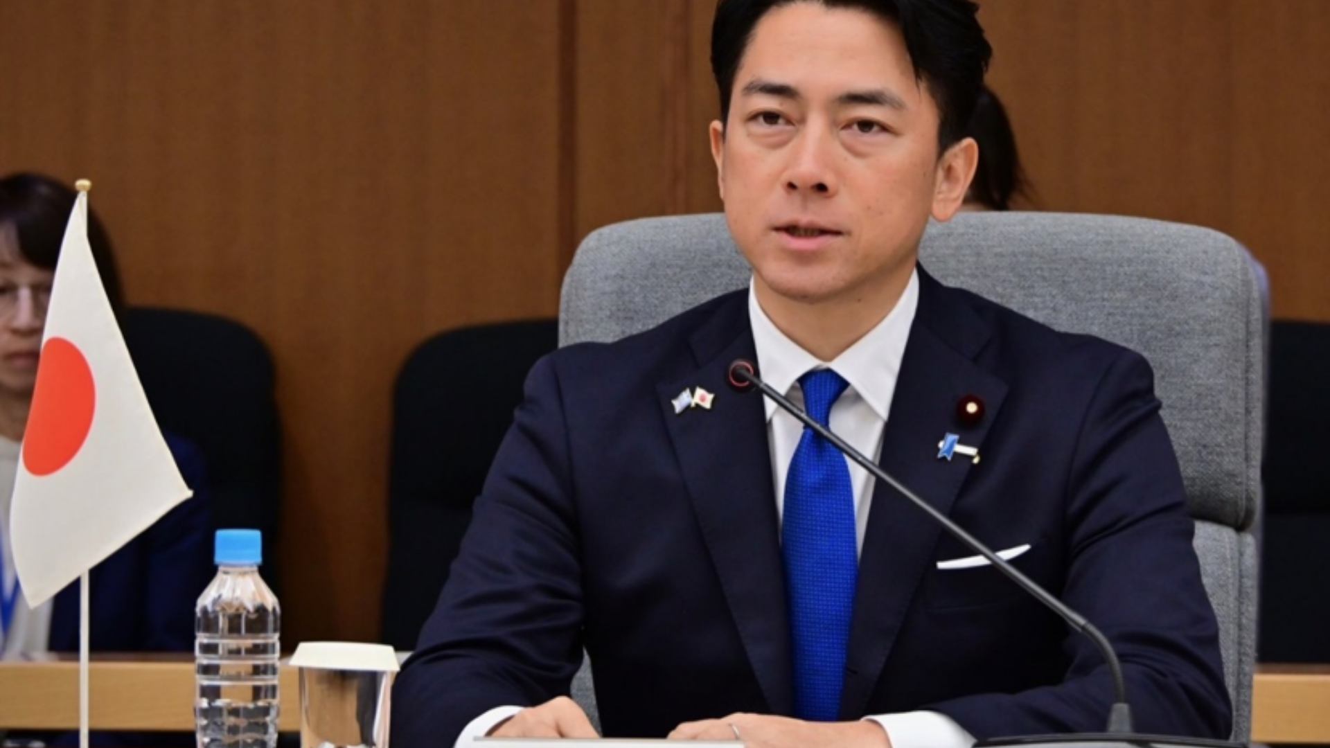 Japanese Defense Minister Koizumi Shinjiro addresses a meeting amid rising regional security concerns.