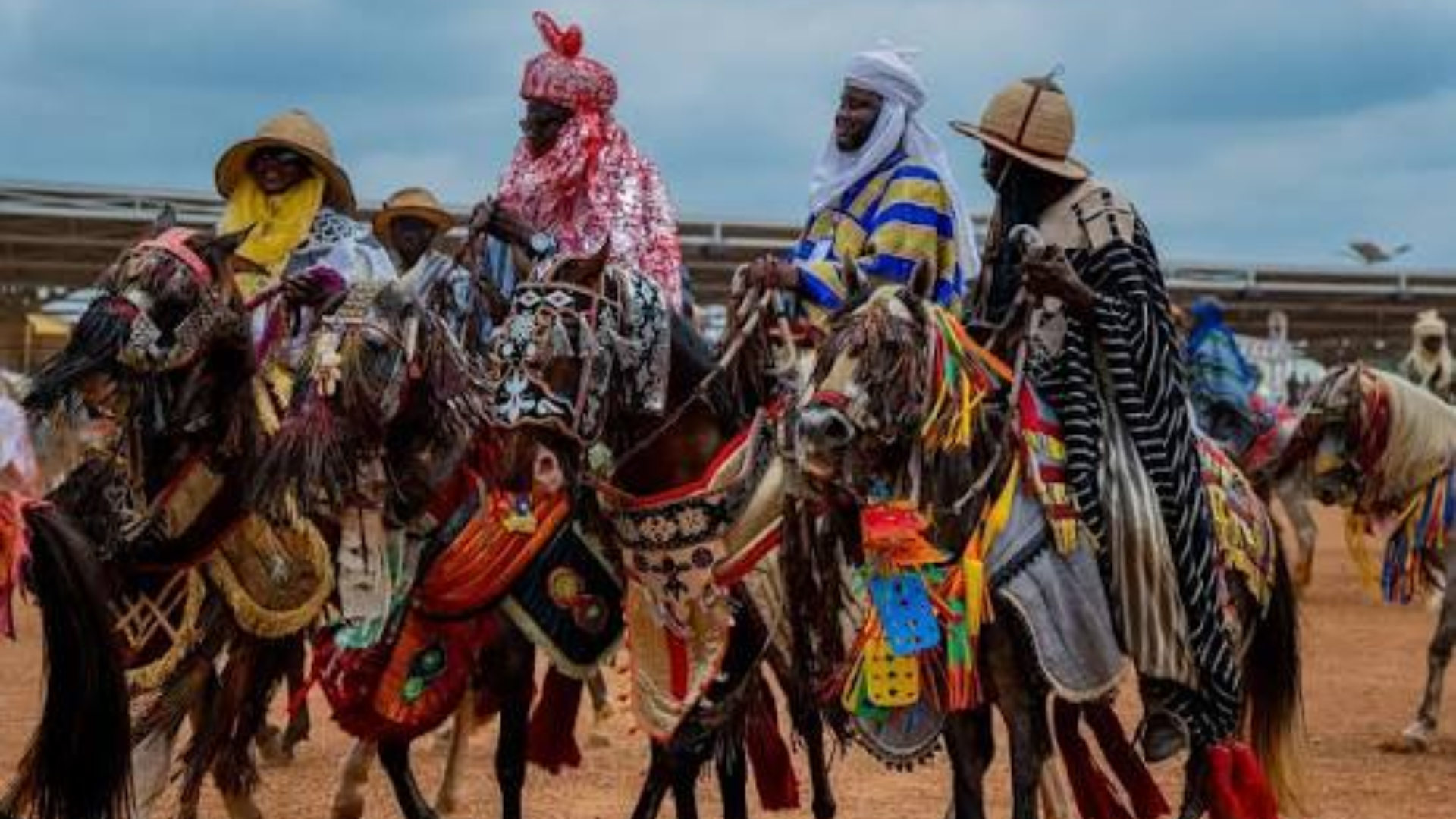 An Emir celebrating Okuta Gaani Festival with Baruba horsemen and traditional drummers in Kwara.