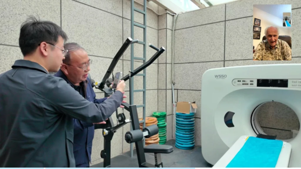 Former hospital president showing David Victor Plymire a donated CT scanner.