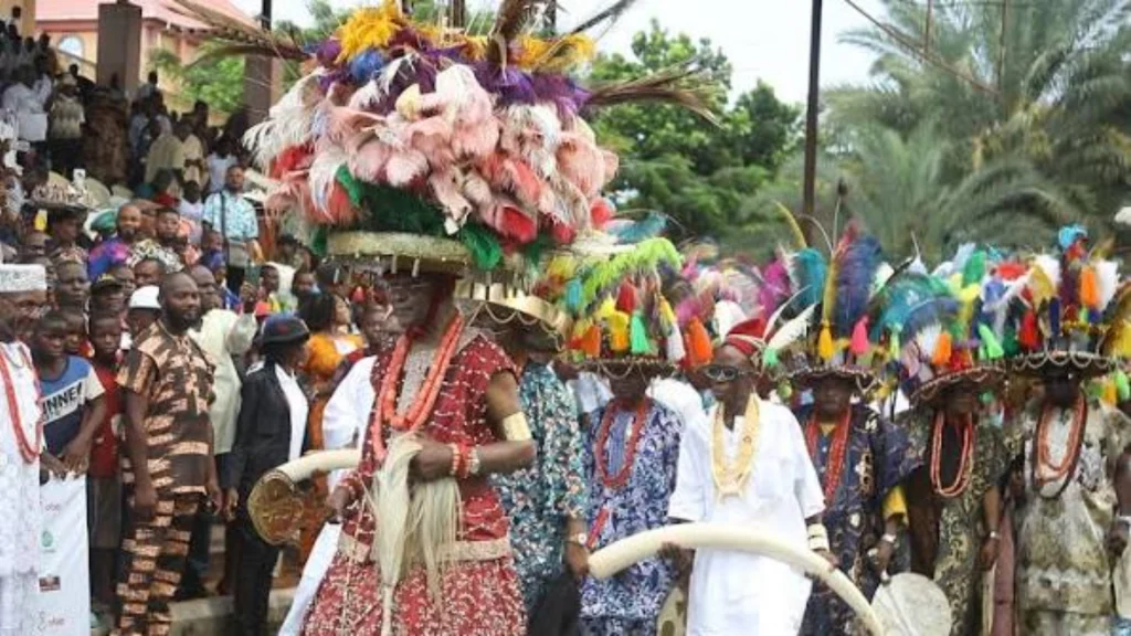 His Majesty Igwe Nnaemeka Achebe, the Obi of Onitsha, dancing in full royal regalia.