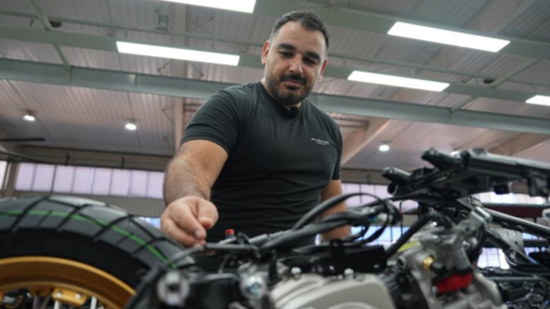 Argentine designer Rodrigo Alvarez fine-tunes a motorcycle on a production line in Taizhou.